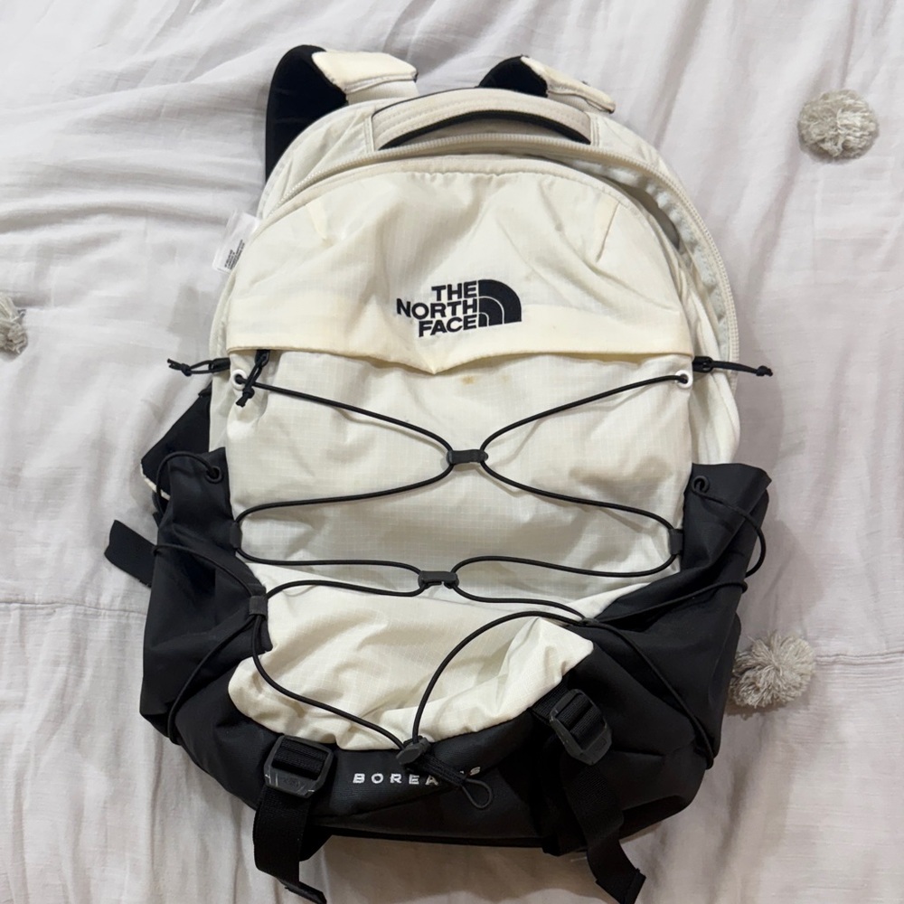 The North Face Cream and Black Backpack